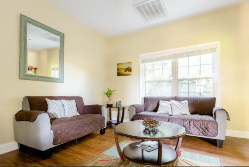 living room with fireplace and bar-height counter top